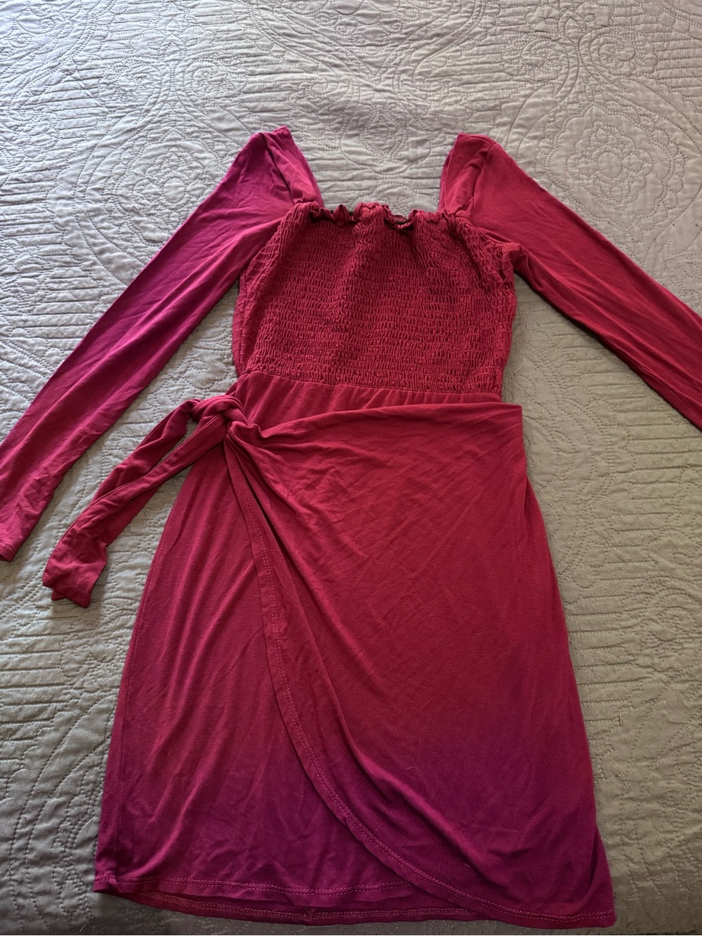Alger’d State Long Sleeve Smocked Wrap Mini Dress in Raspberry